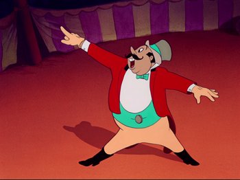 Movie still from “Dumbo” (1941), directed by Ben Sharpsteen – A cartoon of a man in a red jacket; Medium shot, Low angle