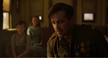 Movie still from “Dumbo” (2019), directed by Tim Burton – A man in a military uniform sitting in front of a woman; Close Up shot, Over the shoulder angle