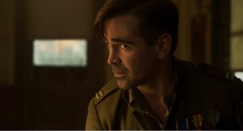 Movie still from “Dumbo” (2019), directed by Tim Burton – A person wearing a military uniform; Close Up shot, Over the shoulder angle