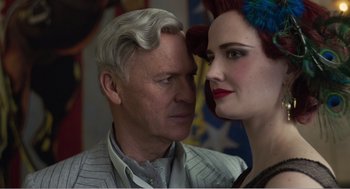 Movie still from “Dumbo” (2019), directed by Tim Burton – An older man and a young woman looking at one another; Close Up shot, Over the shoulder angle