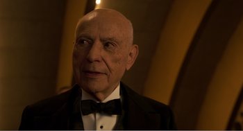 Movie still from “Dumbo” (2019), directed by Tim Burton – An older man in a tuxedo and a bow tie; Close Up shot, Low angle