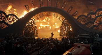 Movie still from “Dumbo” (2019), directed by Tim Burton – A crowd of people sitting in front of a stage; Extreme Wide shot, High angle