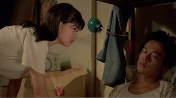 Movie still from “Dust in the Wind” (1986), directed by Hsiao-Hsien Hou – A young girl looking up at an older man; Medium shot, Over the shoulder angle
