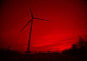 Movie still from “EO” (2022), directed by Jerzy Skolimowski – A wind turbine in the middle of a field; Extreme Wide shot, Low angle