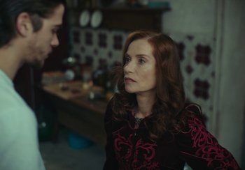 Movie still from “EO” (2022), directed by Jerzy Skolimowski – A man and a woman are talking in a kitchen; Close Up shot, Over the shoulder angle