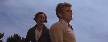 Movie still from “East of Eden” (1955), directed by Elia Kazan – Two young men standing next to each other; Close Up shot, Low angle