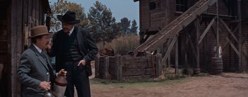 Movie still from “East of Eden” (1955), directed by Elia Kazan – A man standing in front of a wooden structure; Medium shot, Low angle