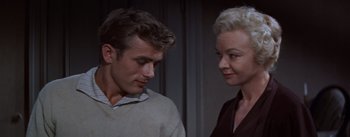 Movie still from “East of Eden” (1955), directed by Elia Kazan – A man and a woman standing next to each other; Close Up shot, Over the shoulder angle