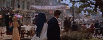 Movie still from “East of Eden” (1955), directed by Elia Kazan – A man and a woman walking down a street; Close Up shot, High angle