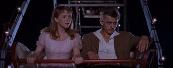 Movie still from “East of Eden” (1955), directed by Elia Kazan – A man and a woman sitting next to each other; Close Up shot, Low angle