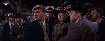 Movie still from “East of Eden” (1955), directed by Elia Kazan – A group of men and women standing next to each other; Medium shot, Low angle