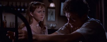 Movie still from “East of Eden” (1955), directed by Elia Kazan – A man and a woman are looking at each other; Close Up shot, Over the shoulder angle