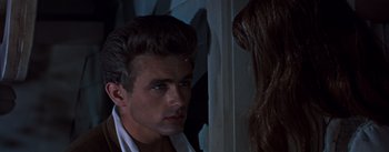 Movie still from “East of Eden” (1955), directed by Elia Kazan – A man and a woman looking at one another; Close Up shot, Over the shoulder angle