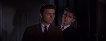 Movie still from “East of Eden” (1955), directed by Elia Kazan – A man in a suit and tie standing next to another man in a suit and tie; Close Up shot, Low angle