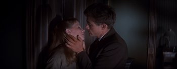 Movie still from “East of Eden” (1955), directed by Elia Kazan – A man and a woman are kissing in a dark room; Close Up shot, Low angle