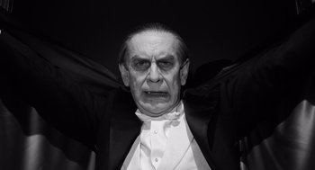 Movie still from “Ed Wood” (1994), directed by Tim Burton – An old man dressed as a vampire with his hands outstretched; Close Up shot, Low angle