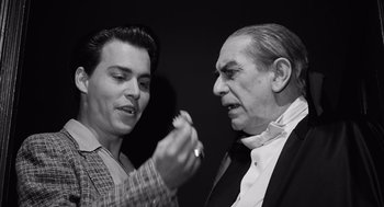 Movie still from “Ed Wood” (1994), directed by Tim Burton – A man and an older man looking at each other; Close Up shot, High angle