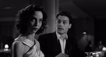 Movie still from “Ed Wood” (1994), directed by Tim Burton – A man and a woman standing next to each other; Close Up shot, Low angle