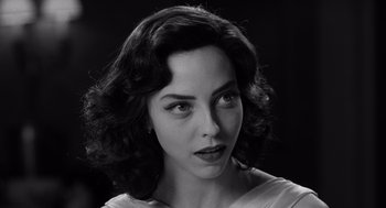 Movie still from “Ed Wood” (1994), directed by Tim Burton – Black and white photograph of a woman in a white dress; Close Up shot, Over the shoulder angle