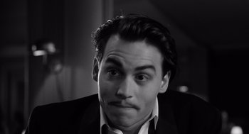 Movie still from “Ed Wood” (1994), directed by Tim Burton – Black and white photograph of a man with a mustache; Close Up shot, High angle