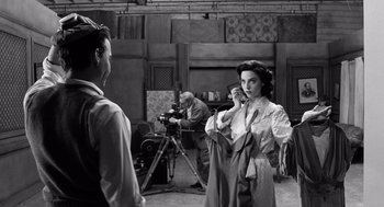 Movie still from “Ed Wood” (1994), directed by Tim Burton – An old photo of a woman talking on the phone; Medium shot, Over the shoulder angle