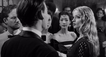 Movie still from “Ed Wood” (1994), directed by Tim Burton – A group of people standing next to each other in front of a mirror; Close Up shot, Over the shoulder angle