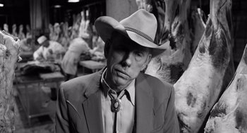 Movie still from “Ed Wood” (1994), directed by Tim Burton – A man wearing a suit and a cowboy hat; Close Up shot, Low angle
