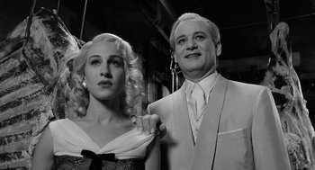 Movie still from “Ed Wood” (1994), directed by Tim Burton – A black and white photo of a man and a woman; Medium shot, Low angle