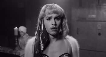 Movie still from “Ed Wood” (1994), directed by Tim Burton – A black and white photo of a woman with a towel on her head; Close Up shot, Low angle
