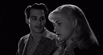Movie still from “Ed Wood” (1994), directed by Tim Burton – A man and a woman standing next to each other; Close Up shot, Low angle