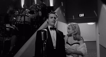 Movie still from “Ed Wood” (1994), directed by Tim Burton – A black and white photo of a man and a woman; Medium shot, Low angle