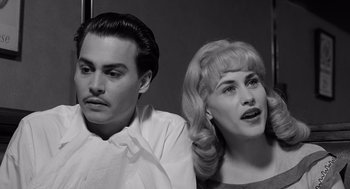 Movie still from “Ed Wood” (1994), directed by Tim Burton – A black and white photo of a man and a woman; Close Up shot, High angle