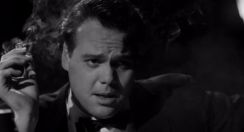 Movie still from “Ed Wood” (1994), directed by Tim Burton – Black and white photograph of a man in a tuxedo; Close Up shot, Low angle