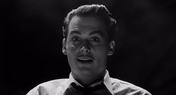 Movie still from “Ed Wood” (1994), directed by Tim Burton – A black and white photo of a man with a mustache; Close Up shot, Low angle