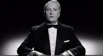 Movie still from “Ed Wood” (1994), directed by Tim Burton – An older man wearing a tuxedo in a black and white photo; Medium shot, Low angle