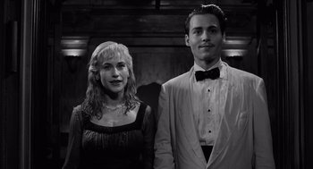 Movie still from “Ed Wood” (1994), directed by Tim Burton – A man and a woman standing next to each other; Medium shot, Low angle