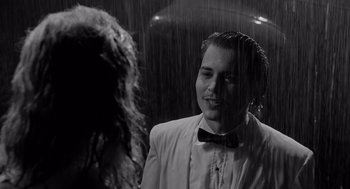 Movie still from “Ed Wood” (1994), directed by Tim Burton – A man in a white jacket and a woman in a white jacket; Medium shot, Over the shoulder angle