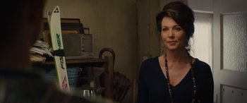 Movie still from “Eddie the Eagle” (2015), directed by Dexter Fletcher – A person standing in a room; Close Up shot, Over the shoulder angle