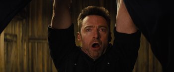 Movie still from “Eddie the Eagle” (2015), directed by Dexter Fletcher – A person with his mouth wide open; Close Up shot, Low angle