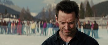 Movie still from “Eddie the Eagle” (2015), directed by Dexter Fletcher – A person with his eyes closed; Close Up shot, Over the shoulder angle