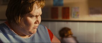 Movie still from “Eden Lake” (2008), directed by James Watkins – A woman with a red bandage around her neck; Close Up shot, Over the shoulder angle