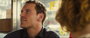Movie still from “Eden Lake” (2008), directed by James Watkins – A man looking out of a window at a woman; Close Up shot, Over the shoulder angle