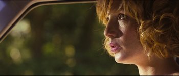 Movie still from “Eden Lake” (2008), directed by James Watkins – A woman's face from a car window; Close Up shot, Low angle