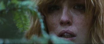 Movie still from “Eden Lake” (2008), directed by James Watkins – The face of a young woman; Extreme Close Up shot, Low angle