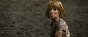 Movie still from “Eden Lake” (2008), directed by James Watkins – A person with mud all over her face; Close Up shot, Low angle