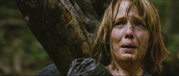 Movie still from “Eden Lake” (2008), directed by James Watkins – A person with wet clothes on; Close Up shot, Low angle