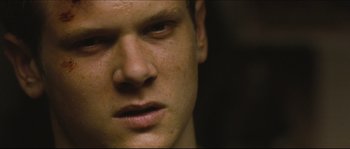 Movie still from “Eden Lake” (2008), directed by James Watkins – A young man's face; Close Up shot, Low angle