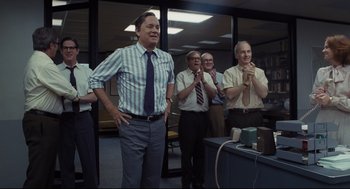 Movie still from “The Post” (2017), directed by Steven Spielberg – A group of people standing in a room; Medium shot, Low angle