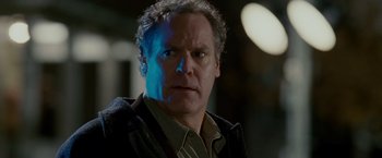 Movie still from “Edge of Darkness” (2010), directed by Martin Campbell – A man that is staring at the camera; Close Up shot, Low angle