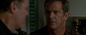 Movie still from “Edge of Darkness” (2010), directed by Martin Campbell – An older man looking at a younger man with blood all over his face; Close Up shot, Over the shoulder angle